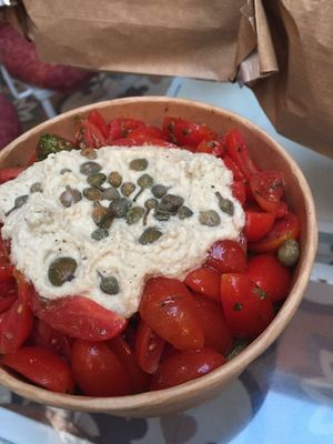 daco salad (bread, tomatoes, verde sauce, capers and hummus) at Cookoomela Grill in Athens