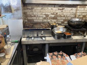  Cooking the souvlaki at Cookoomela Grill in Athens