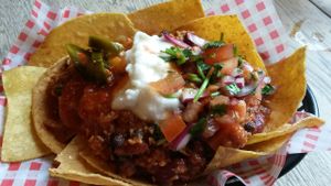 Coconut & bean chilli nachos served with jalapenos, sour cream, chilli jam & salsa at The 78 in Glasgow
