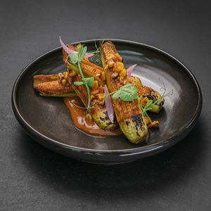 JAGUNG BAKAR - Chargrilled baby corn, chili butter, seaweed flakes at Merah Putih in Seminyak