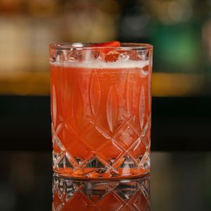 STRAWBERRY RUM PUNCH - Rum, amaretto, strawberry, orgeat bitters at Merah Putih in Seminyak