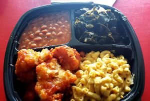 fried cauliflower, greens, mac and cheese and baked beans!

Really tasty food!  It not sit with a menu kind of place, more buffet.  Pick 4.  No bad choices.  They have ice cream! at Sweet Soulfood in New Orleans