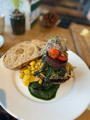 The full English! Sausage pea meat, roasted portobello mushroom with potato rosti, spiced beans and Docker sourdough  at Dr Legumes in Folkestone