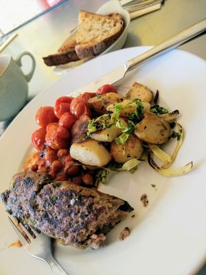 all day breakfast - sausage, potatoes, tomatoes and beans  at Dr Legumes in Folkestone