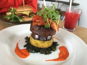 Tomato salsa, miso pea meat, aubergine, polenta and sautéed greens 😋 SO GOOD  at Dr Legumes in Folkestone