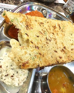 Onion Rava Dosa: crispy rice flour and semolina crepe sprinkled with onion, served with homemade chutney and sambar at Naamaste Indian Restaurant in Paphos
