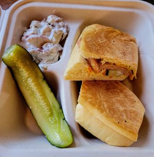 Cuban sandwich with a side of potato salad at Falcon Coffee Bar in Nashville