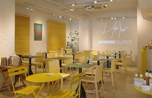 Bright, clean interior in yellow and green — a calm and welcoming space just minutes from Omotesando Station. Perfect for a mindful lunch, solo visit or catch-up with friends. at L for You in Tokyo