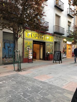 Exterior of eatery, outside seating opposite at Espana Cani in Madrid