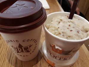 Turmeric latte with coconut-rice milk and quinoa porridge at LGW - Pret A Manger -  ST in Horley