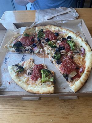 Vegan cheese and vegetable toppings  at Blaze Pizza in Toronto
