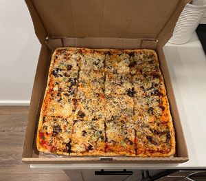 Large square beautiful juicy vegan pizza with melty vegan cheese at Cousin Vinnie's NY Pizza Cafe in San Juan Island