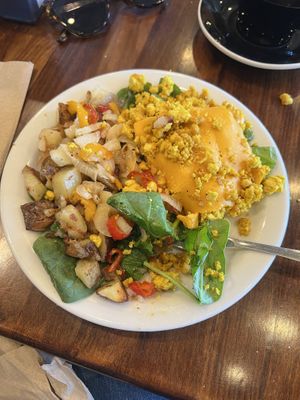 Tofu scramble plate with peppers and onions, spinach, and extra potatoes  at Nori's Village Market in Saranac Lake