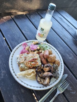 Lasagne, grilled veggies, vegan sausages, pasta salad, roasted potatoes, olive spread, pesto. at Hermans in Stockholm