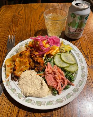  1st plate with lots of veggies, lasagna and hummus  at Hermans in Stockholm