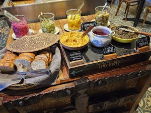 Appetizers: bread, spreads, pickles at Hermans in Stockholm
