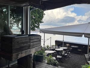 Outdoor seating with harbor views  at Hermans in Stockholm