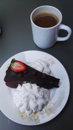 Chocolate cake and whipped cream (all vegan). Tea is free at Hermans. at Hermans in Stockholm