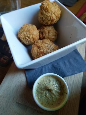 Vegan bitterballen: a stew-based snack served with mustard at Brouwerij Het Anker in Mechelen