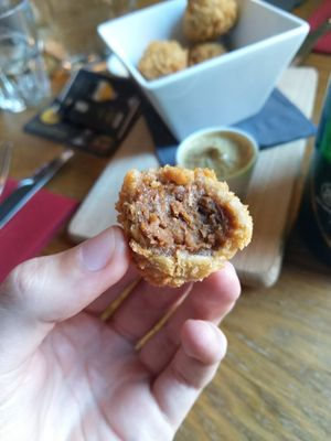 Vegan bitterballen: a stew-based snack served with mustard at Brouwerij Het Anker in Mechelen