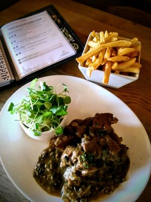 Flemish seitan stew with Gouden Carolus Classic and Belgian fries at Brouwerij Het Anker in Mechelen