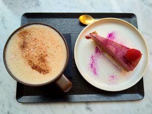 Raw cake (strawberry/dragon fruit) and hot cocoa. at Matcha Bar - Helgolandsgade in Copenhagen