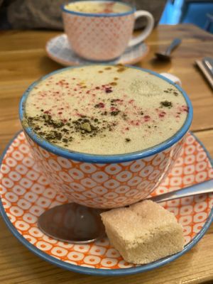 Matcha latte with oat milk & vegan shortbread  at Gandhi's Cafe in Ambleside
