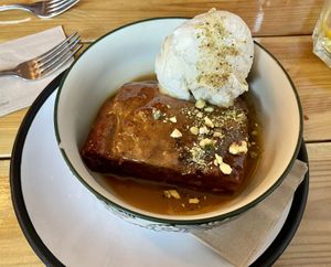 Vegan sticky toffee chai pudding and ice cream  at Gandhi's Cafe in Ambleside
