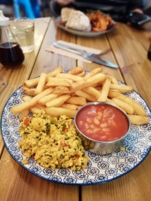 Chips, beans and tofu scramble.. Comfort food 😋 at Gandhi's Cafe in Ambleside