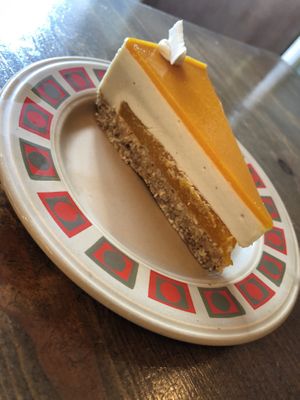 Passion fruit and mango raw cheesecake  at Gandhi's Cafe in Ambleside