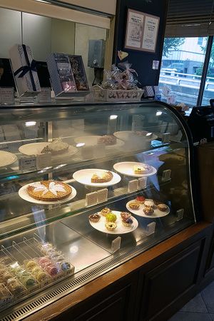 Interior of location, view towards cashier and display of tartes at La Bonne Tarte in Seoul