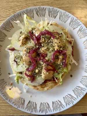 vegan langoš covered in veggies and mayo  at Dvanast Dusi in Bratislava