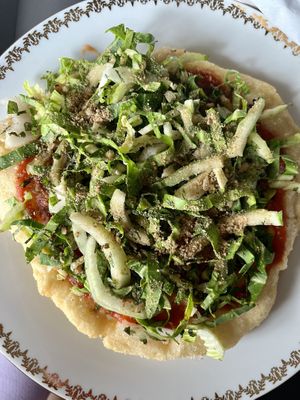 vegan langoš: homemade ketchup, fermented wild garlic, vegan cheese, pile of fresh herbs  at Dvanast Dusi in Bratislava