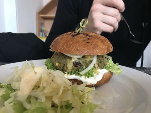 Boyfriend´s burger made from delicious bun.  at Roots Fresh Food Bistro in Prague