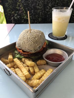 Asian dance party burger with fries and smoothe at Black House Burgers in Kuta