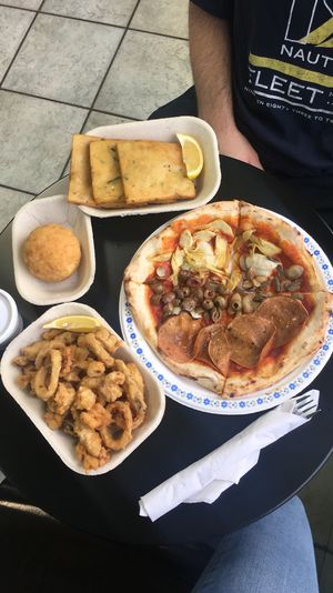 (Clockwise from the left) arancini, panelle, quattro stagioni, and calamari at The Vegitaliano in Vaughan