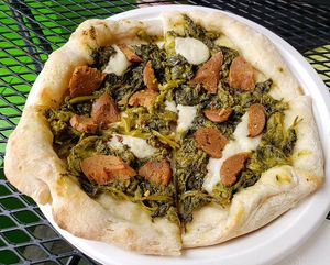 Homemade sausage, vegan mozzarella, and rapini pizza. Photo taken May 2019. at The Vegitaliano in Vaughan