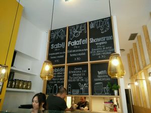 big menu on the wall at Falafeleria - Sta Barbara in Madrid