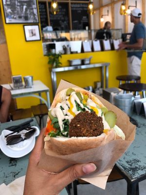 stuffed falafel with lots of veggies sauces and hot falafels/pita at Falafeleria - Sta Barbara in Madrid