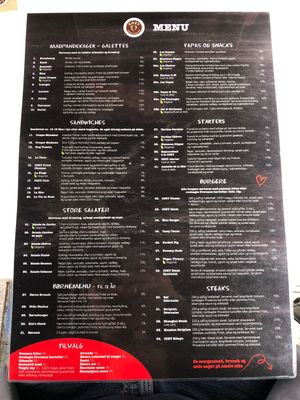 One side of the menu, updated with a total of 4 vegan options and some more vegetarian    at Cozy Creperie & Coffee Shop in Vejle