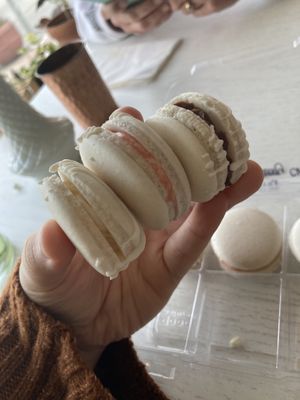 Top to bottom: chocolate, vanilla strawberry, and vanilla macaroons  at Eden Cafe & Bakeshop in Batavia