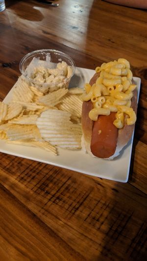Carrot dog with mac & cheese, pasta salad, and chips. at Eden Cafe & Bakeshop in Batavia