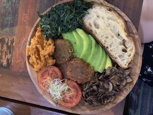 Full breakfast with tomato, home made baked beans (YUM), sautéd mushroom, avocado, spinach & sourdough toast! at Namaskara Coffee & Superfoods in Ubud