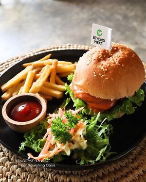 Discover the enticing world of plant-based cuisine with our signature Beyond Meat Burger. Grab it now! at Namaskara Coffee & Superfoods in Ubud