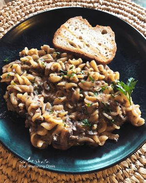 Taste the rich and creamy flavor of our Creamy Mushroom Pasta with house-made coconut creamy sauce. at Namaskara Coffee & Superfoods in Ubud