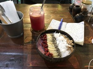 Smoothie bowl with maqui berries, strawberries, blueberries and almond milk. Topped with granola, coconut flakes, chia seeds and goji berries. at Namaskara Coffee & Superfoods in Ubud