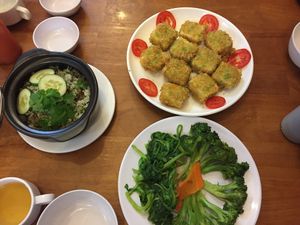 Sauteed veggies from the buffet, an lac claypot rice, crispy tofu at Au Lac in Da Lat