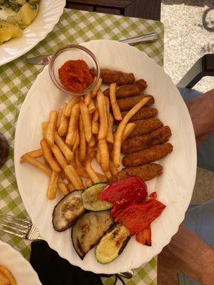 Vegan cevapcici with ajvar, grilled vegetables and French fries at Labirint in Koper