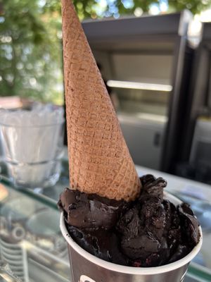 Chocolate/raspberry gelato with cone on top  at Kavarna Cacao in Ljubljana