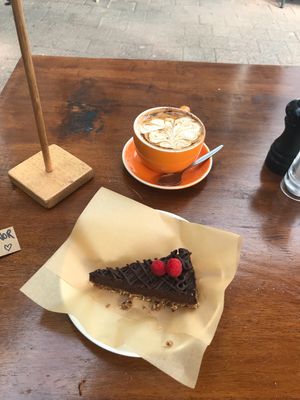 Vegan raw cake & soy cappuccino  at Sunday Sustainable Bakery in Byron Bay